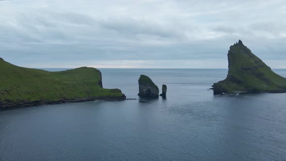 Drone Towards Drangarnir Sea Stacks In Faroe Islands