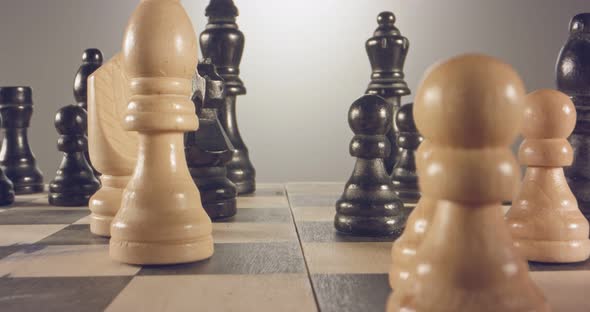 Special tracking macro shot moving between chess pieces on a chess board