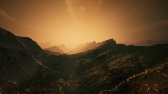 High Mountain Peaks Covered with Dramatic Heavy Fog alt