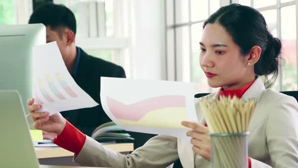 Business People Working at Table in Modern Office