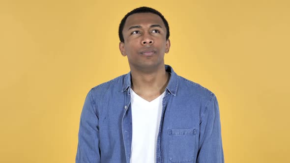 Thinking Young African Man Got New Idea Yellow Background