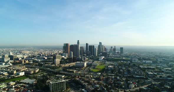 Rising aerial view of LA's skyscrapers from the north end of the city, circa 2018.