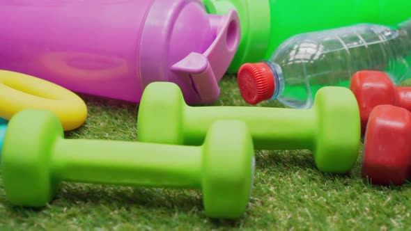 Fitness Equipment Set on Green Grass Close Up