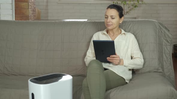 Woman with Ultrasonic Purifier