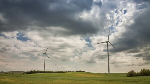 Windmill on green field in summer on a sunny day, timelapse, 4K