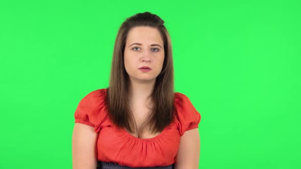 Portrait of Frightened Girl Saying Oh My God and Being Shocked. Green Screen