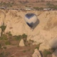 Hot Air Balloon with Blue White Envelope Hangs Near Cliff - VideoHive Item for Sale
