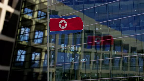 Korea North Flag Waving On A Skyscraper Building