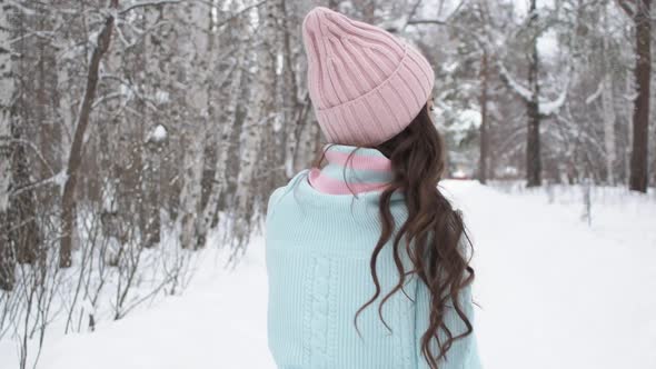 Stylish Young Woman Walking Towards Winter Forest