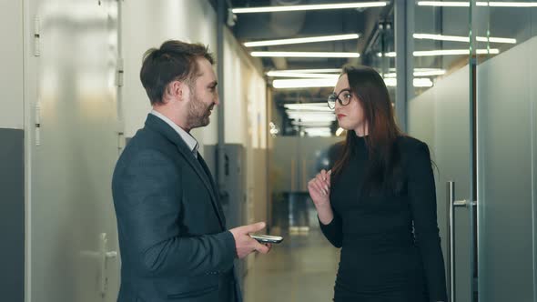 Man and Woman Communicate and Shake Hands