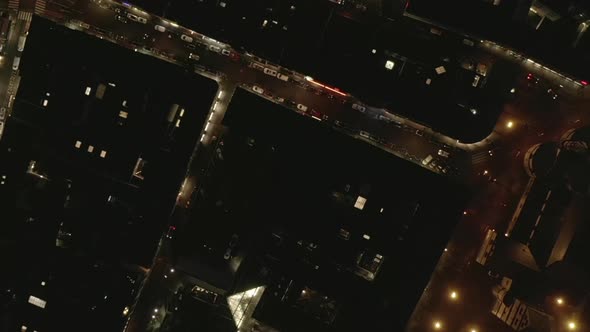 AERIAL: Slow Overhead Shot of City at Night with Lights and Traffic, Cologne, Germany 