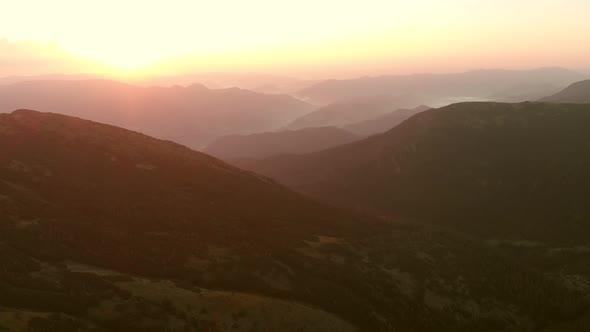 Sunset Sky Over Mountains Peaks in Summer