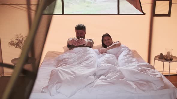 Couple Waking up in Morning