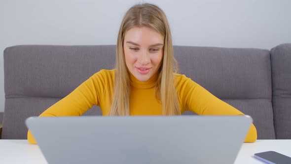 Beautiful white woman talking on computer web cam during video call in 4k stock video