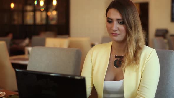 Business Girl Working Using a Mobile Computer