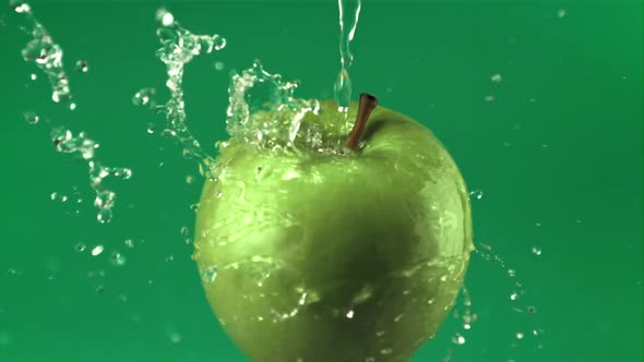 Super Slow Motion Water Droplets Fall on a Rotating Fresh Apple