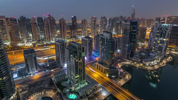 Aerial Top View of Dubai Marina Night to Day Timelapse