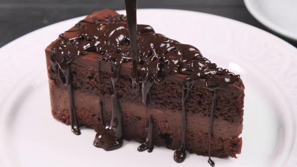 Pour chocolate piece of chocolate cake.