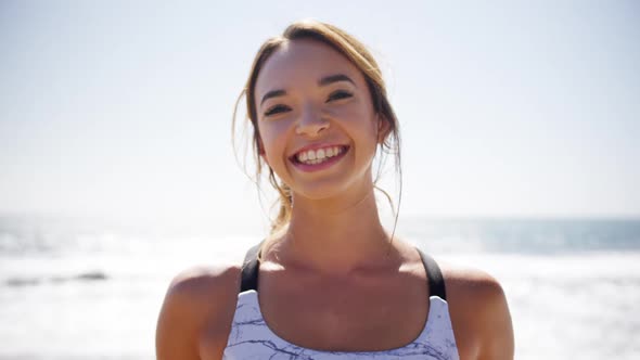 Beautiful woman leaning on railing at beach 4k