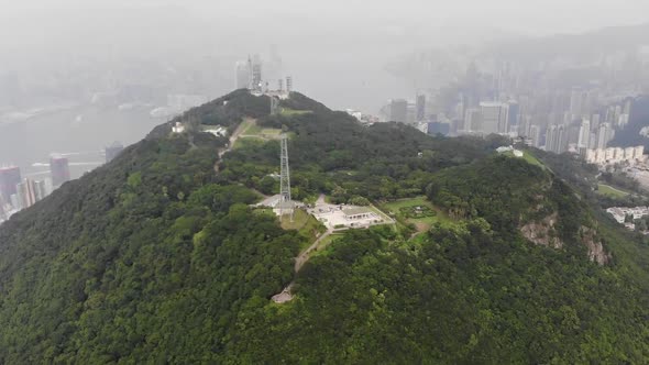 Approaching Hong Kong Island from behind a hill drone