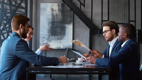 Businessmen at a meeting to discuss a working project in the office