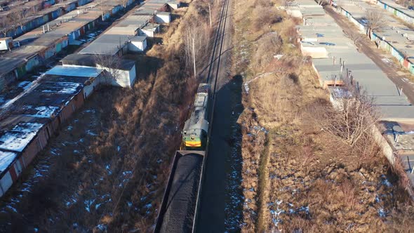 Cargo train on a railroad in sunny winter day