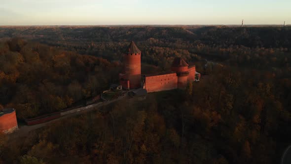 Establishing Shot: Aerial Pan Right Around Turaida Castle in Autumn