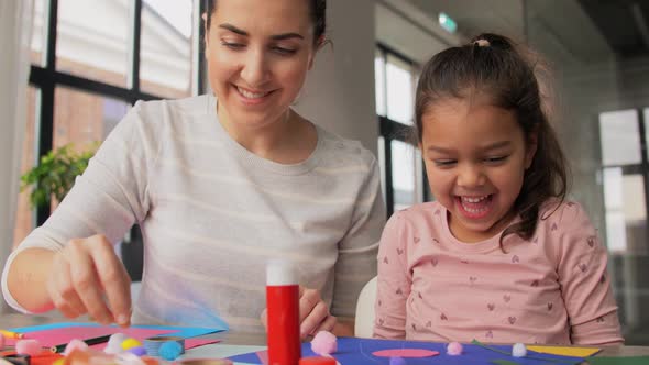 Daughter with Mother Making Applique at Home