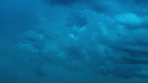 Timelapse of movement of dark blue night heavy clouds 4k footage alt