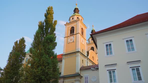 Church Historical Building with Towers Near Trees and House