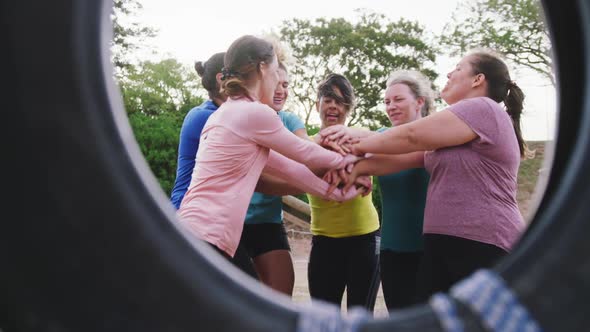 Female friends enjoying exercising at boot camp together