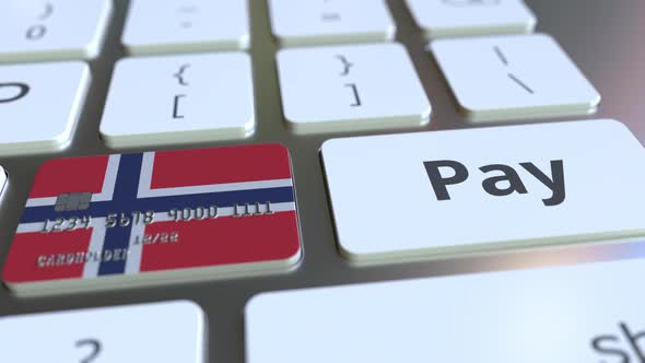 Bank Card with Flag of Norway As a Key on a Keyboard alt