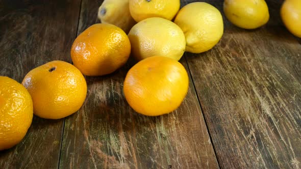 Cooks Job. Different Citrus Fruit Throwing From Paper Bag Onto Wooden Table. Tangerine and Lemon