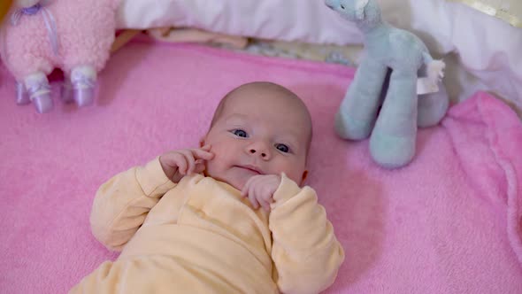 The Baby Is in the Crib. The Child Tossing and Turning. The Camera Zooms