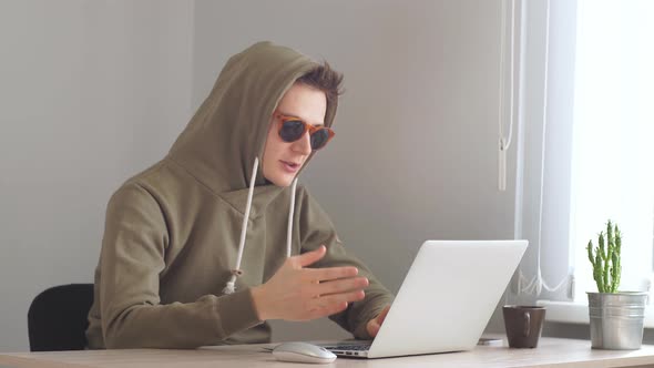 Young Hacker Concentrated on Coding, Hacker Looking at Screen Monitoring Stock Online