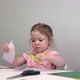 the Child Cuts Colored Paper with Scissors - VideoHive Item for Sale