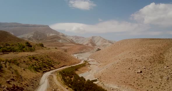 truck driven in mountain agriculture foothills roads with apple trees and farms