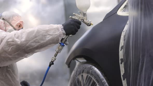 Painting Spray Paint Lacquer Vehicle Parts at Car Service Workshop