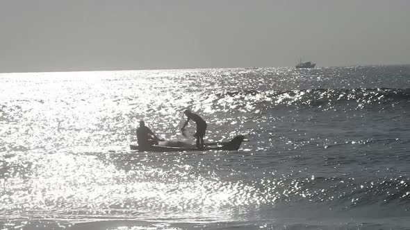 People fishing in ocean in morning, traditional boat fishing in sea. Sea fishing boat in morning.