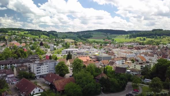 Flying backwards over the beautiful city of Bülach in the Summer.