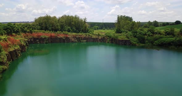 Old stone mining hole today turned into a beautiful emerald lake, dam-breaking created this beautifu