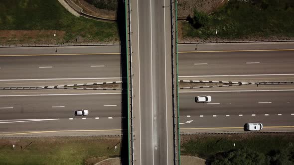 Directly Above View of Highway Intersection Car Bridge and Moving Cars