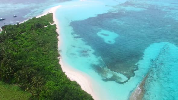 Aerial texture of coastline beach by blue water with sand background