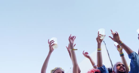 Group of friends having fun at music festival 4k