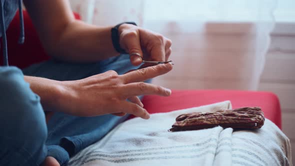 Man Cuts His Nails in the Room