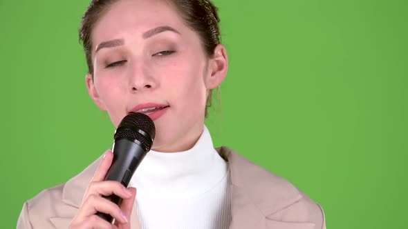 Singer Sings a Cheerful and Melodic Song. Green Screen