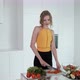Young Woman Slicing Red Pepper For Vegetable Salad.  White Modern Kitchen. - VideoHive Item for Sale