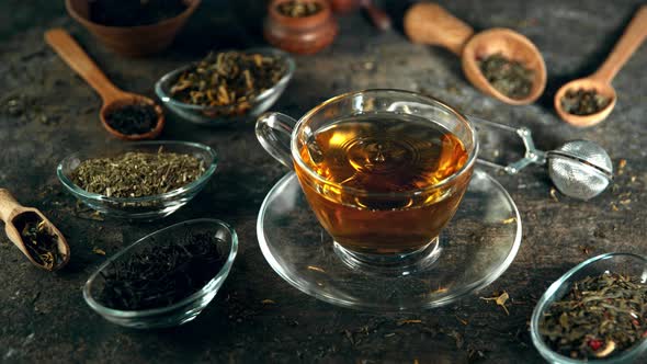 Super Slow Motion Shot of Droplet Falling Into Tea at 1000 Fps with Still Life Background