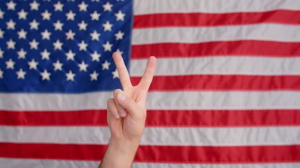 American Flag Stock Video Footage - A Person Doing Peace Sign