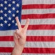 American Flag Stock Video Footage - A Person Doing Peace Sign - VideoHive Item for Sale